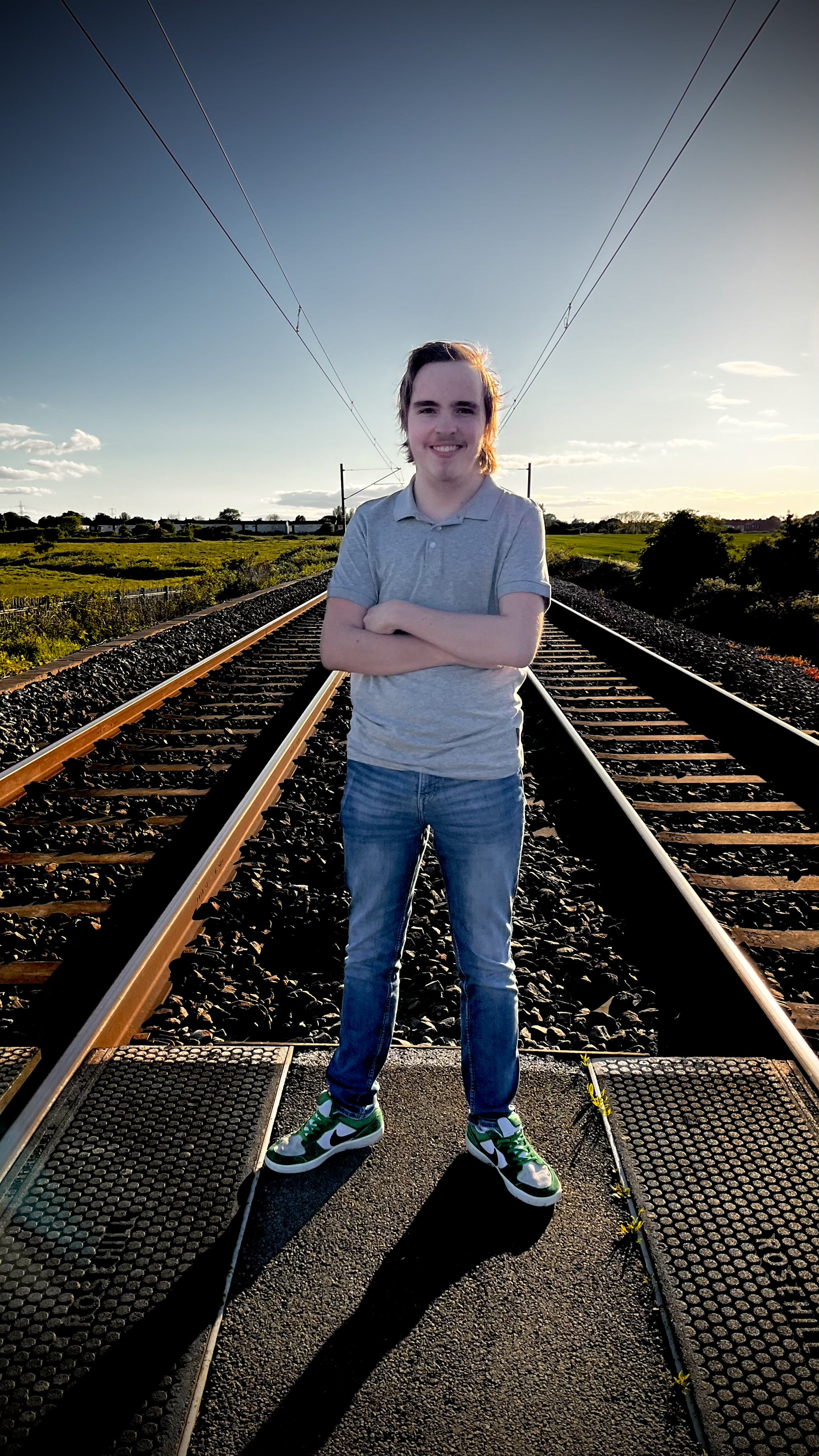 Will sitting on a metro crossing, portrait